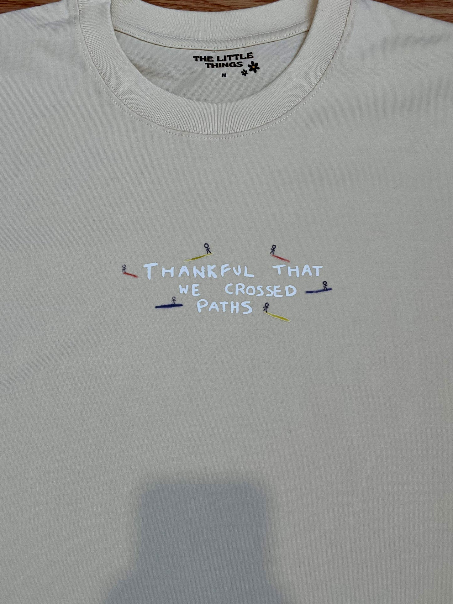Crossed Paths Cream Tee